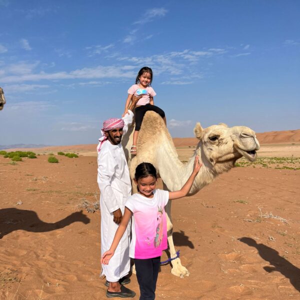 Camel riding desert camp Oman