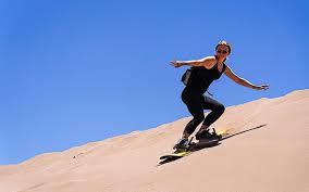 Sandboarding desert camp Wahiba sands